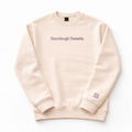 Beige sweatshirt with 'Sourdough Sweetie' text and logo on a white background