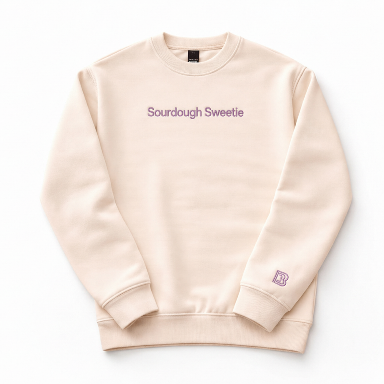 Beige sweatshirt with 'Sourdough Sweetie' text and logo on a white background