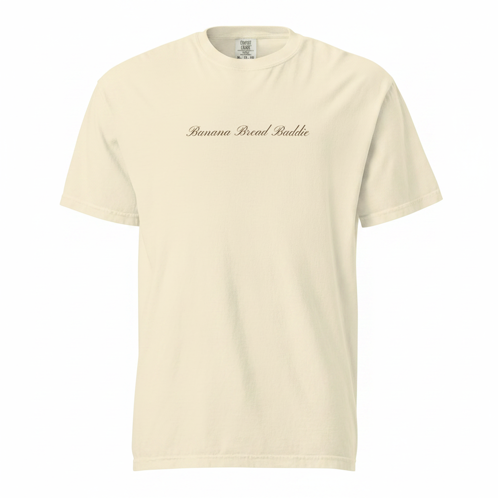 Ivory t-shirt with a espresso banana bread baddie logo on a white background
